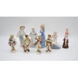 An assortment of Continental figurines including a "bathing belle"