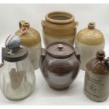 A collection of stoneware flagons including Chick of Bridport and Pope Brothers Yeovil along with