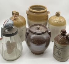 A collection of stoneware flagons including Chick of Bridport and Pope Brothers Yeovil along with