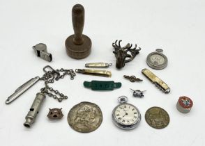 A collection of interesting items including whistles, Ingersoll pocket watch, enamelled Railway