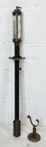 A brass ship's barometer on gimbal arm with leather covered body by JJBLM, 16 a 22 R. N. Desterro,