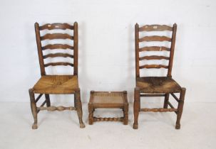 A pair of antique ladderback chairs along with a footstool