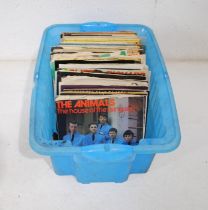 A quantity of 7" vinyl records, including The Beatles, The Animals, Queen, UB40, The Style