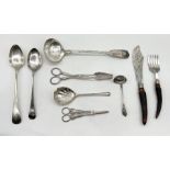 A silver plated ladle, two serving spoons, horn handled fish servers along with other silver
