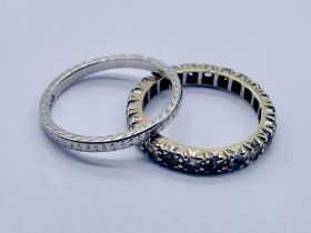 A platinum wedding band (marked PT97), weight 2.7g along with a 9ct gold eternity ring set with