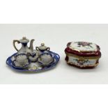 A hand painted miniature tea set along with a Limoges pot signed "Sully" with gilt hinge and