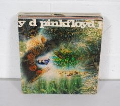 A collection of fourteen rock 12" vinyl records, comprising Pink Floyd, David Bowie, The Rolling