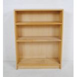 A modern freestanding bookcase - length 80cm, depth 28cm, height 106cm