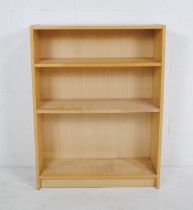 A modern freestanding bookcase - length 80cm, depth 28cm, height 106cm