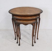 A burr-walnut nest of three tables, with cabriole legs and carved detailing