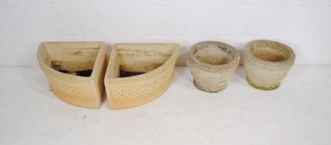 A pair of Cotswold Studios reconstituted stone garden planters along with two further pots