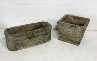 Two weathered reconstituted stone garden planters