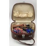 A collection of vintage costume jewellery, beads etc in leather Pukka Luggage case