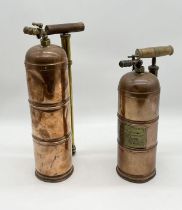 Two antique copper fire extinguishers, one with French instructions to front