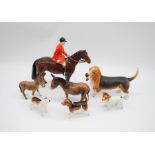 A collection of Beswick including donkeys, Jack Russell, huntsman (A/F), Bassett Hound etc.
