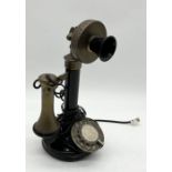 An antique style candlestick telephone