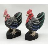 A pair of carved wooden hand painted chickens