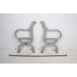 A pair of weathered painted silver cast iron garden bench ends with support bar