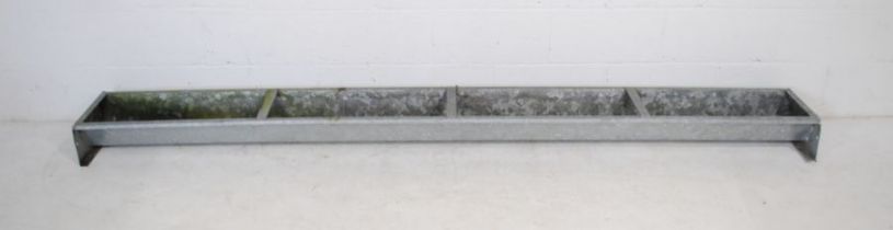 A galvanised metal animal feeding trough - length 273cm, depth 34cm, height 16cm