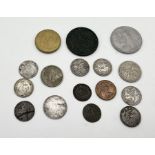 A small collection of coins including some silver