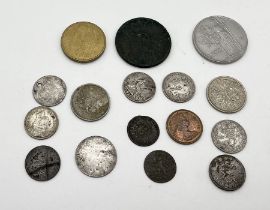 A small collection of coins including some silver