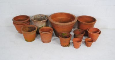 A quantity of various sized terracotta garden pots