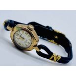 A 9ct gold Sekonda ladies wristwatch on leather strap