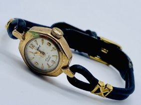 A 9ct gold Sekonda ladies wristwatch on leather strap