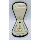 A cased silver and guilloche enamelled sewing set- replacement scissors and damaged to enamel on one
