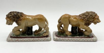 A pair of reproduction Staffordshire lions