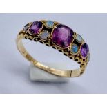 A Victorian 15ct gold amethyst and opal ring