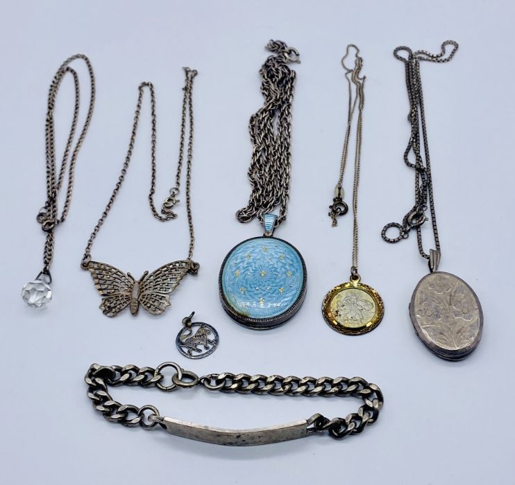 A small collection of silver jewellery including an enamelled silver locket, chains, pendants etc.