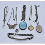 A small collection of silver jewellery including an enamelled silver locket, chains, pendants etc.
