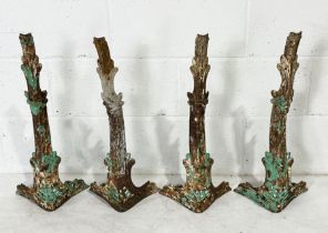 A set of four cast iron table legs with pierced decoration