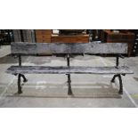 A 19th century cast iron twig and branch garden bench, with weathered wooden plank seat - length