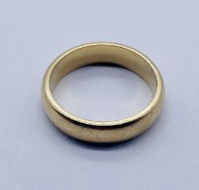A large sized 9ct gold wedding band, weight 9.8g