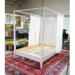 A Zenia House four poster double bed