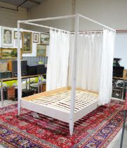 A Zenia House four poster double bed