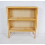 A modern freestanding bookcase - length 90.5cm, depth 32cm, height 103cm