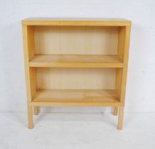 A modern freestanding bookcase - length 90.5cm, depth 32cm, height 103cm