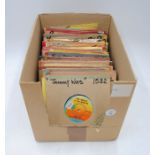 A collection of reggae 7" vinyl records, including Bob Marley and The Wailers, Max Romeo and The