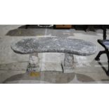 A weathered reconstituted stone curved garden bench with squirrel supports - length 120cm, height