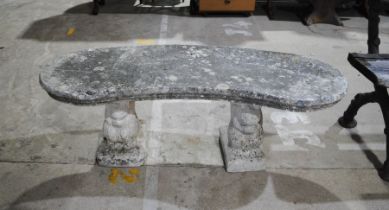 A weathered reconstituted stone curved garden bench with squirrel supports - length 120cm, height