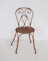 A well weathered metal garden chair