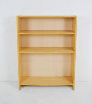 A modern freestanding bookcase - length 80cm, depth 28cm, height 107cm