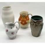 A collection of jugs and vases comprising of a studio pottery vase in the form of an owl signed to