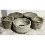 A collection of reconstituted stone garden pots including two pairs and one other
