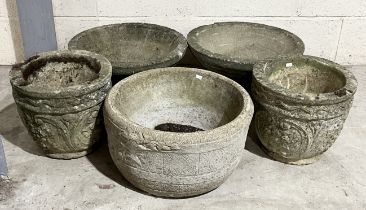 A collection of reconstituted stone garden pots including two pairs and one other