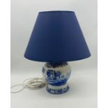 A Spode Blue Italian table lamp with blue shade