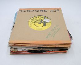 A small collection of ska 7" vinyl records, including Bad Manners, The Beat, The Specials, Judge